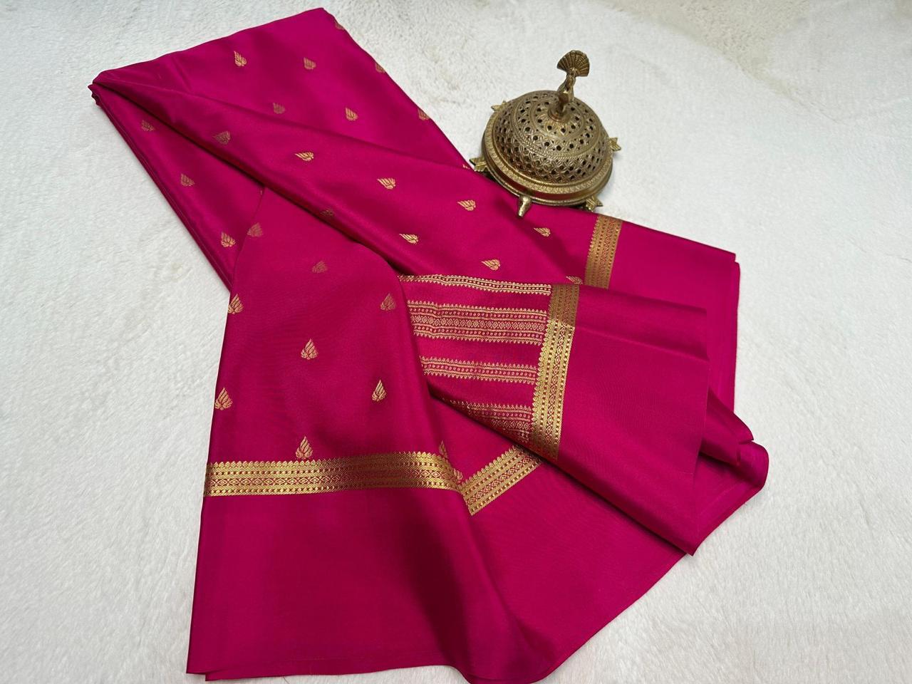 Pink saree with gold patterns on a white background